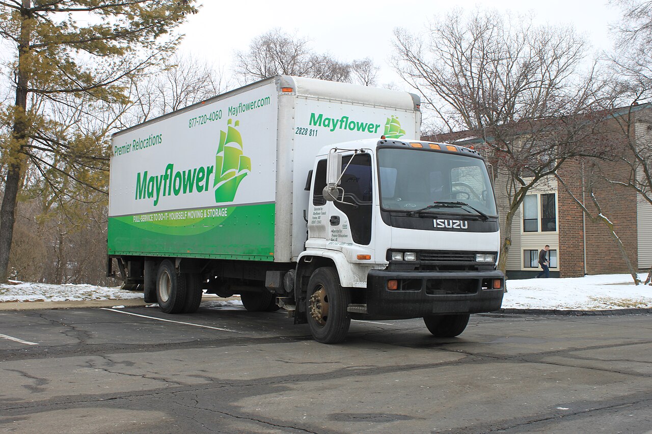 A moving company truck parked on a residential street